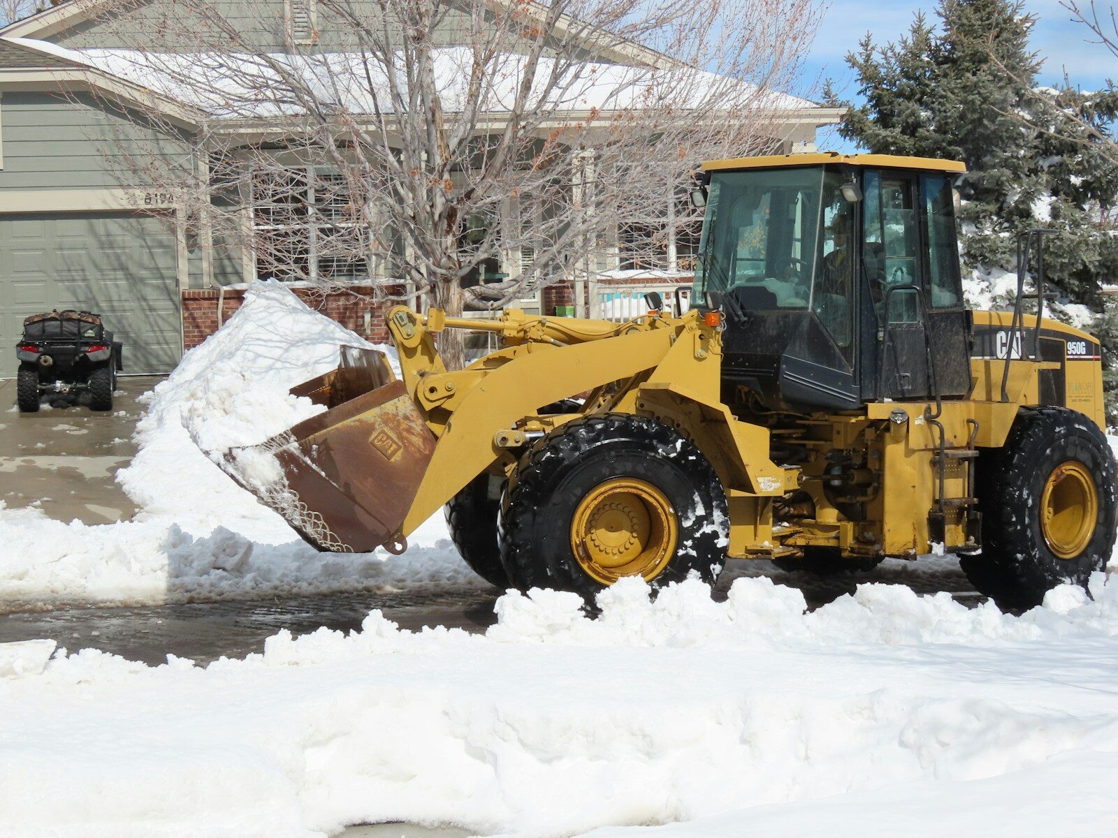 yellow and black heavy equipment on snow covered ground